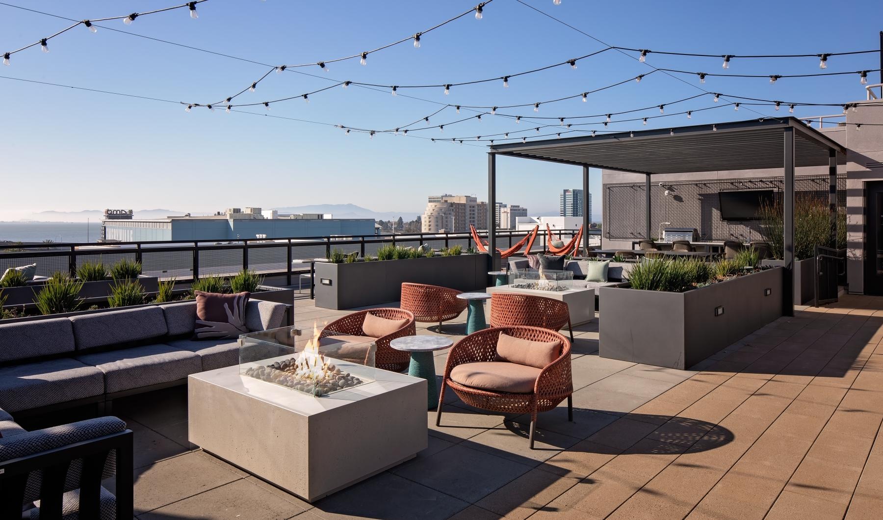 Find your perfect fit at The Emery a patio with chairs and tables