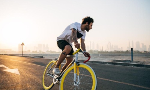 Find your perfect fit at The Emery a man riding a bicycle on a road